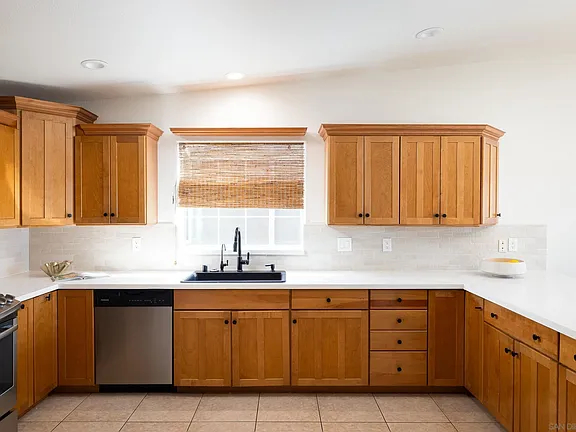 Kitchen sink and window with woven shade